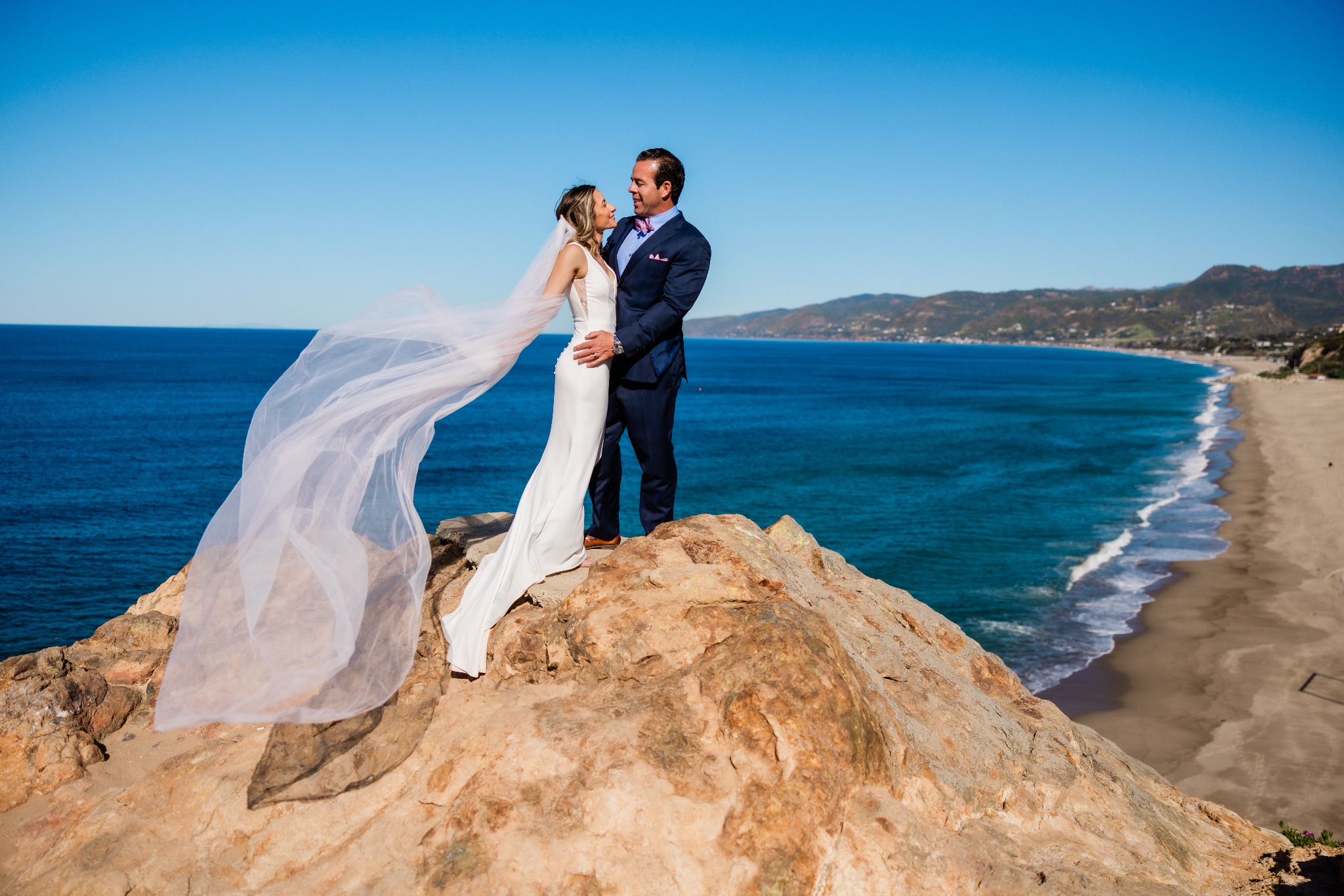 Sean Tarpenning and Mackaylee Tarpenning on their wedding day overlooking the ocean